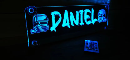 Illuminated LED truck nameplate reading 'DANIEL' with suction cup and custom truck design, perfect for LKW cabins.