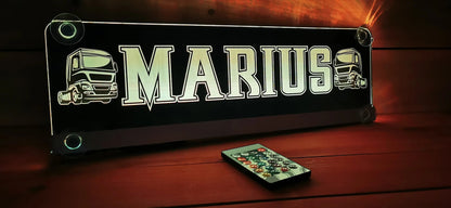 Illuminated LED truck nameplate with remote, customizable design for truck drivers, featuring "Marius" and truck graphic.