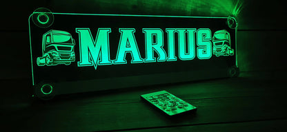 Illuminated LED truck nameplate with suction cups, personalized with 'MARIUS' in green lighting, remote control included.