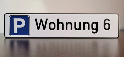 Parking sign for "Wohnung 6" on a 3 mm Aludibond plate with UV-resistant print, showcasing durability and custom signage options.
