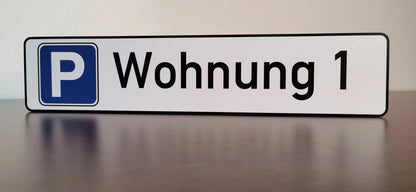 "Wohnung 1" parking sign on a sturdy Aludibond plate, ideal for personalized building signage with logo, weather-resistant.