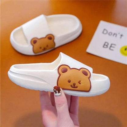 Children's slipper with bear design, ideal for comfort at home, showcasing soft and lightweight material with playful pattern.