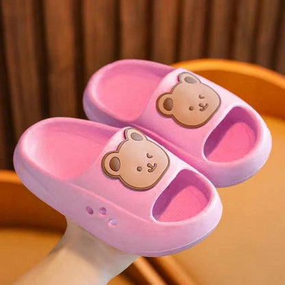 Children's pink slippers with bear design, providing ultimate comfort and cushioning for little feet.