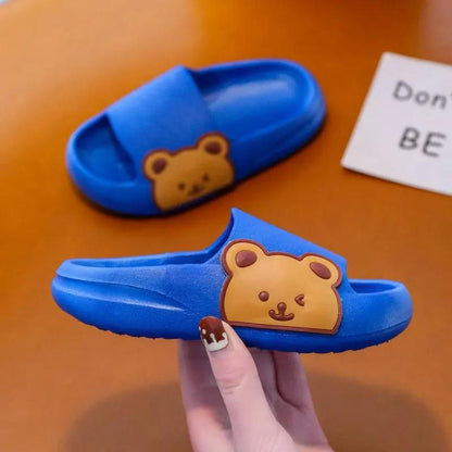 Blue children's cloud slippers with bear design, offering comfort and softness for kids.