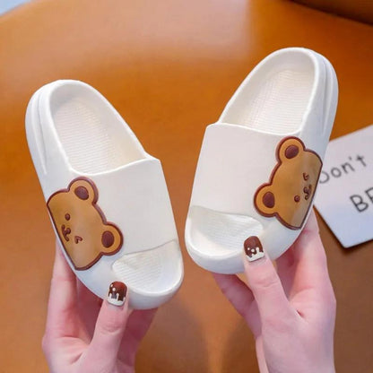 Children's slippers with teddy bear design, soft and comfy for toddlers. Ideal for cozy playtime. High-quality, durable materials.