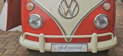 Wedding auto sign 'Just married' on a vintage red Volkswagen van, perfect for personalized car decoration.